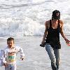 Victoria Beckham and Cruz Beckham

 playing walking the beach.