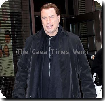 John Travolta 
arriving at BET studios in Manhattan.