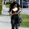 Vanessa Hudgens returning to her car after shopping, to find it has a flat tire. Los Angeles.