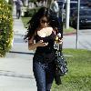 Vanessa Hudgens returning to her car after shopping, to find it has a flat tire. Los Angeles.