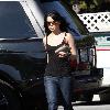 Vanessa Hudgens returning to her car after shopping, to find it has a flat tire. Los Angeles.