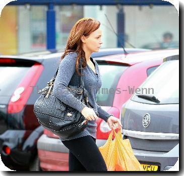 Chanelle Hayes
walks back to her car after doing some shopping at Sainsbury's.
Yorkshire, England.