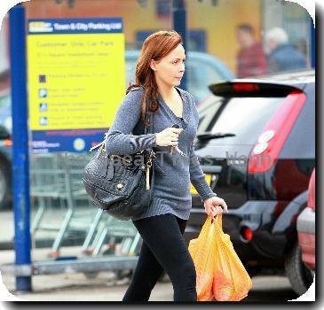 Chanelle Hayes
walks back to her car after doing some shopping at Sainsbury's.
Yorkshire, England.