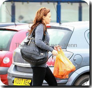 Chanelle Hayes walks back to her car after doing some shopping at Sainsbury's. Yorkshire.