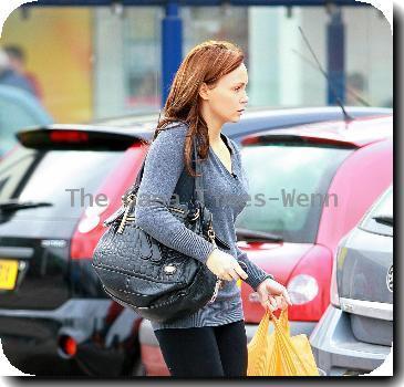 Chanelle Hayes walks back to her car after doing some shopping at Sainsbury's. Yorkshire.