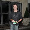 Simon Cowell leaving his hotel in flared jeans and a packet of KOOL brand menthol cigarettes London.