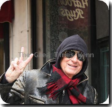 Joel Schumacher flashes a peace sign while out and about in Manhattan New York City.