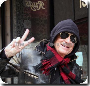 Joel Schumacher flashes a peace sign while out and about in Manhattan New York City.