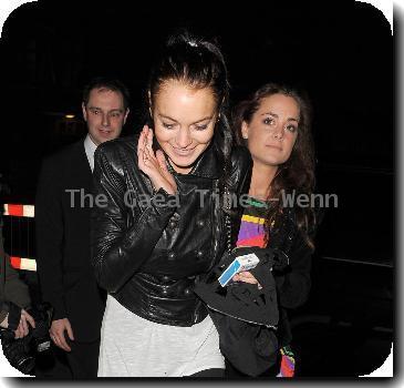 Lindsay Lohan arrives back at her hotel just after 4.30am after a night out at a nearby club. Lindsay was in a cheerful mood, despite being locked out of her hotel! After a few loud bangs on the door, her group were finally let in!
London, England.