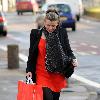 Coleen Rooney carrying a large bag after shopping at a United Colors of Benetton store.
Liverpool, England.