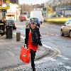 Coleen Rooney carrying a large bag after shopping at a United Colors of Benetton store.
Liverpool, England.