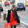 Coleen Rooney carrying a large bag after shopping at a United Colors of Benetton store.
Liverpool, England.