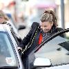 Coleen Rooney returns to her car after shopping at United Colors of Benetton Liverpool.