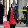 Coleen Rooney returns to her car after shopping at United Colors of Benetton Liverpool.