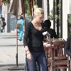 Sophie Monk walking in Hollywood with a foot cast after her recent car accident in Marina del Rey. She is also wearing a back brace and had much difficulty walking due to her injuries. Los Angeles.