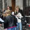 Fearne Cotton running to her car to avoid the rain after leaving the BBC Radio 1 studios London.