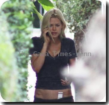 Sophie Monk talking in her mobile phone after putting out the trash near her home.A scar is visible on her right hip, as a result from a car accident earlier this year (10)Los Angeles.