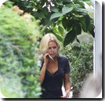 Sophie Monk talking in her mobile phone after putting out the trash near her home.A scar is visible on her right hip, as a result from a car accident earlier this year (10)Los Angeles.