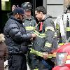 Mike Lombardi and Steven Pasquale
smoking while on the set of 'Rescue Me' filming in Harlem
New York City, USA.