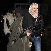 Agyness Deyn arriving at Bungalow 8 nightclub with a female friend. In her rush to get inside the club, Aggy slipped on the wet pavement and almost fell over, which she and her friend found hilarious London.
