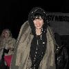 Agyness Deyn arriving at Bungalow 8 nightclub with a female friend. In her rush to get inside the club, Aggy slipped on the wet pavement and almost fell over, which she and her friend found hilarious London.