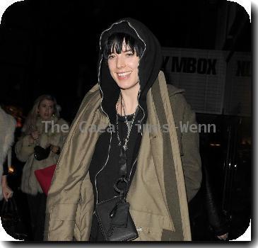 Agyness Deyn arriving at Bungalow 8 nightclub with a female friend. In her rush to get inside the club, Aggy slipped on the wet pavement and almost fell over, which she and her friend found hilarious London.