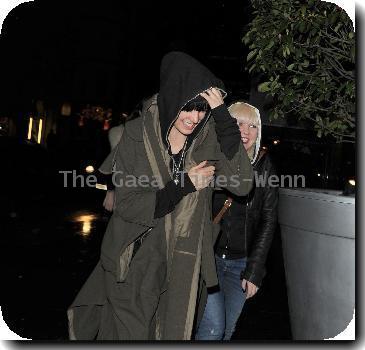Agyness Deyn arriving at Bungalow 8 nightclub with a female friend. In her rush to get inside the club, Aggy slipped on the wet pavement and almost fell over, which she and her friend found hilarious London.