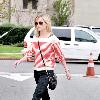 Reese Witherspoon leaving a restaurant in Brentwood while wearing a striped sweater Los Angeles.