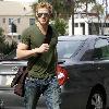 Kellan Lutz out and about in Beverly Hills while carrying a brown messenger bag Los Angeles.