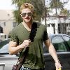 Kellan Lutz out and about in Beverly Hills while carrying a brown messenger bag Los Angeles.