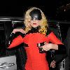 Joanne Stefani Germanotta aka Lady GaGa looks more like a robot than a pop star, as she arrives back at her London hotel just after 1.30am, having performed at the 02 Arena earlier in the evening. GaGa was wearing ripped fishnet stockings, a black visor shaped mask across her face and forehead, and a small video camera mounted on her red and black outfit, which she held in place to finish off the bizarre look!
 London, England.