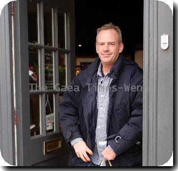 Norman Cook aka Fat Boy Slimshopping at 'Gresham Blake' a Tailored Suit Store in Brighton. Sussex.