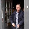 Norman Cook aka Fat Boy Slimshopping at 'Gresham Blake' a Tailored Suit Store in Brighton. Sussex.