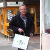 Norman Cook aka Fat Boy Slimshopping at 'Gresham Blake' a Tailored Suit Store in Brighton. Sussex.