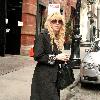 Courtney Love out and about in Soho wearing pajamas and smoking a cigarette New York City.