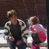 Larry Birkhead 
playing with his daughter, Dannielynn Birkhead, at a park
Los Angeles, California.