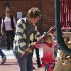 Larry Birkhead 
playing with his daughter, Dannielynn Birkhead, at a park
Los Angeles, California.