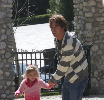 Larry Birkhead 
playing with his daughter, Dannielynn Birkhead, at a park
Los Angeles, California.