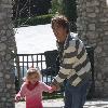 Larry Birkhead 
playing with his daughter, Dannielynn Birkhead, at a park
Los Angeles, California.