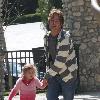 Larry Birkhead 
playing with his daughter, Dannielynn Birkhead, at a park
Los Angeles, California.