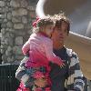 Larry Birkhead 
playing with his daughter, Dannielynn Birkhead, at a park
Los Angeles, California.