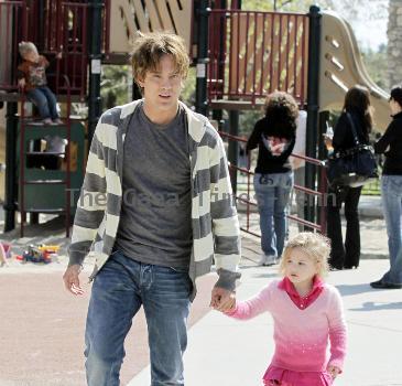 Larry Birkhead 
playing with his daughter, Dannielynn Birkhead, at a park 
Los Angeles, California.