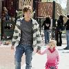 Larry Birkhead 
playing with his daughter, Dannielynn Birkhead, at a park 
Los Angeles, California.