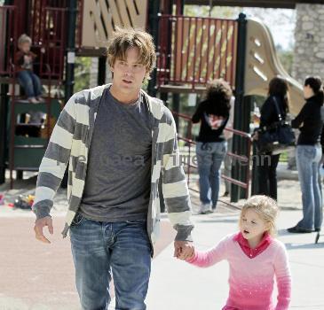 Larry Birkhead 
playing with his daughter, Dannielynn Birkhead, at a park 
Los Angeles, California.