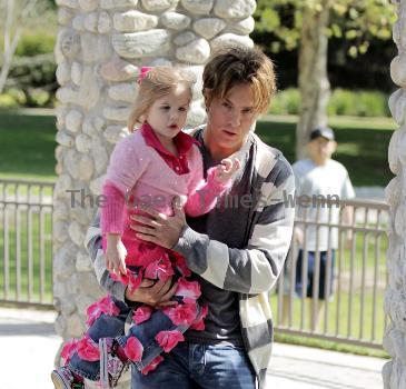 Larry Birkhead 
playing with his daughter, Dannielynn Birkhead, at a park 
Los Angeles, California.