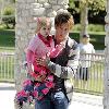 Larry Birkhead 
playing with his daughter, Dannielynn Birkhead, at a park 
Los Angeles, California.