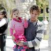 Larry Birkhead 
playing with his daughter, Dannielynn Birkhead, at a park 
Los Angeles, California.