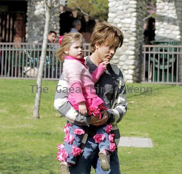 Larry Birkhead 
playing with his daughter, Dannielynn Birkhead, at a park 
Los Angeles, California.