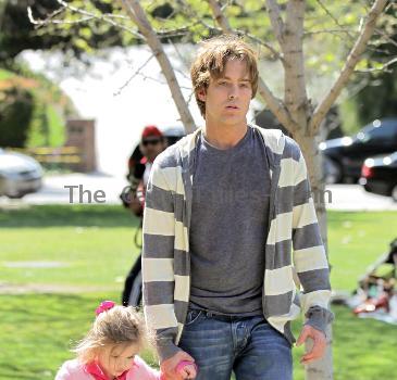 Larry Birkhead 
playing with his daughter, Dannielynn Birkhead, at a park 
Los Angeles, California.