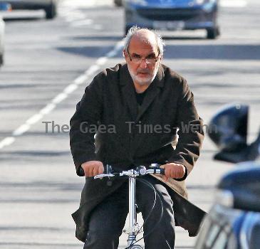 Alan Yentob rides his bicycle in West London London.